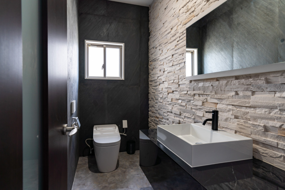 Photo of a contemporary powder room in Other.