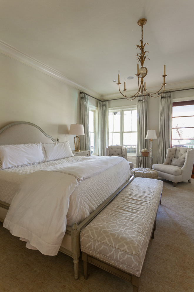 Photo of a mid-sized traditional master bedroom in Charleston with beige walls, carpet and no fireplace.
