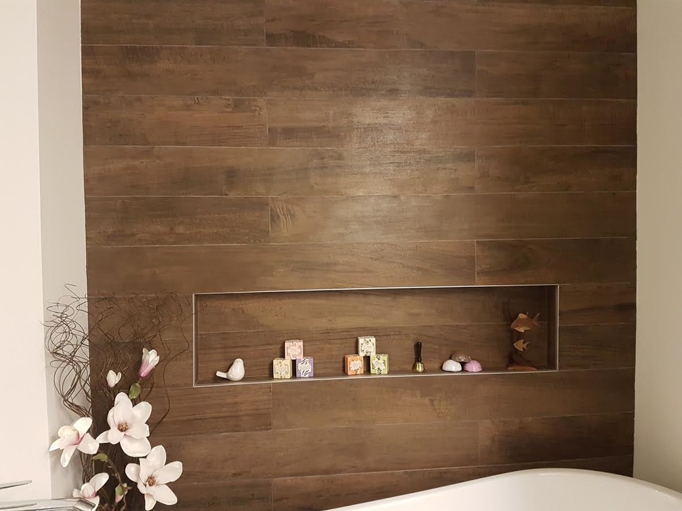 Example of a mid-sized transitional master brown tile and porcelain tile slate floor and gray floor freestanding bathtub design in Orange County with white walls, open cabinets and dark wood cabinets
