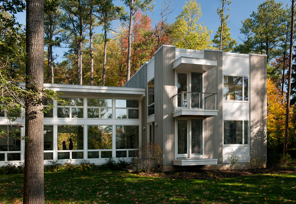 Mid-sized contemporary two-storey grey exterior in DC Metro with wood siding.