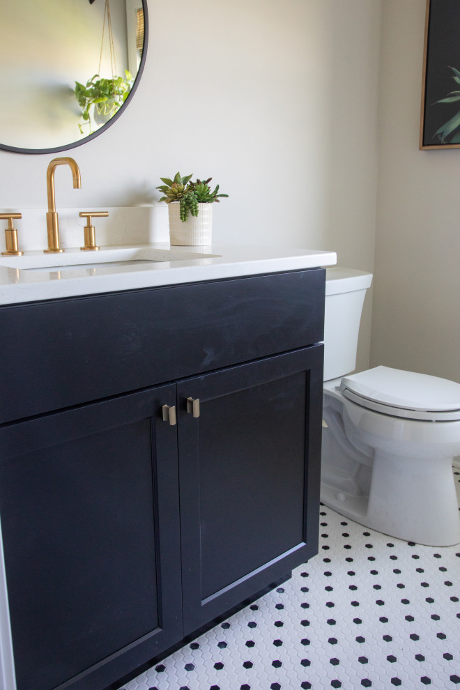 Design ideas for a small country bathroom in Other with black cabinets, a one-piece toilet, white walls, porcelain floors, a console sink, white floor, white benchtops, a single vanity and a built-in vanity.