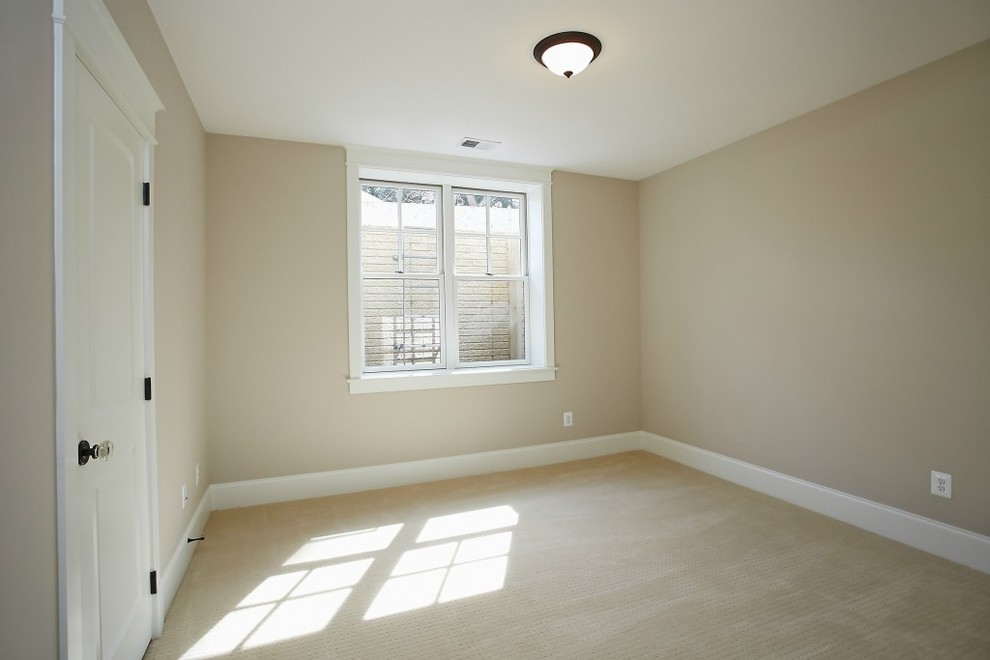 Design ideas for a large arts and crafts guest bedroom in DC Metro with beige walls, carpet, no fireplace and beige floor.