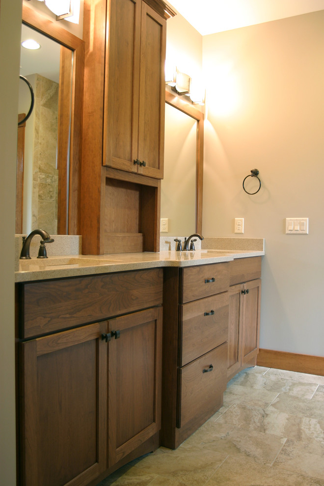 Inspiration for a large arts and crafts master bathroom in Cincinnati with granite benchtops, shaker cabinets, medium wood cabinets, beige tile, ceramic tile, green walls, ceramic floors and an undermount sink.