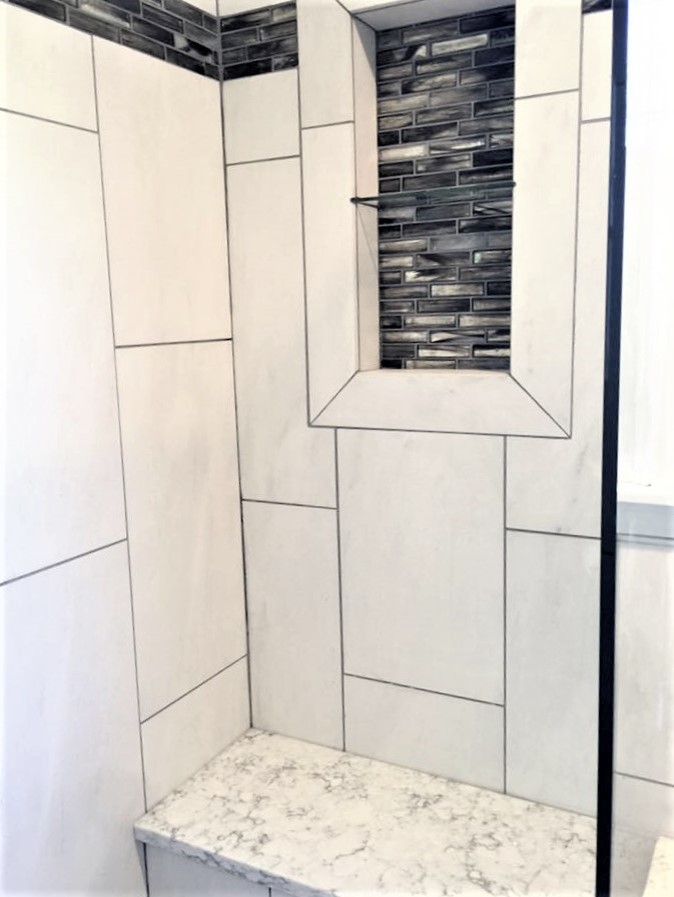 Example of a mid-sized transitional 3/4 multicolored tile and stone slab vinyl floor alcove shower design in Orange County with shaker cabinets, gray cabinets, a two-piece toilet, gray walls, an undermount sink and granite countertops