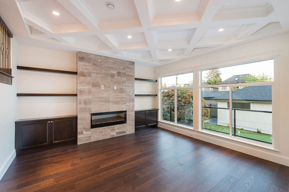 This is an example of a mid-sized traditional formal open concept living room in Vancouver with white walls, dark hardwood floors, a standard fireplace, a tile fireplace surround and no tv.