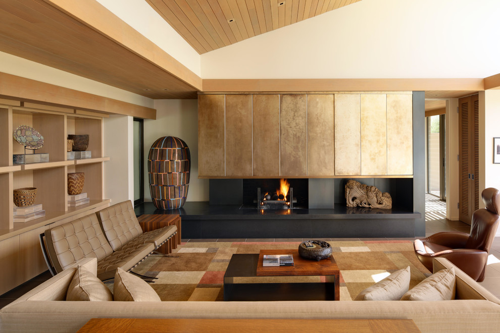 Photo of a small asian formal open concept living room in San Diego with white walls, a metal fireplace surround, a standard fireplace and a concealed tv.