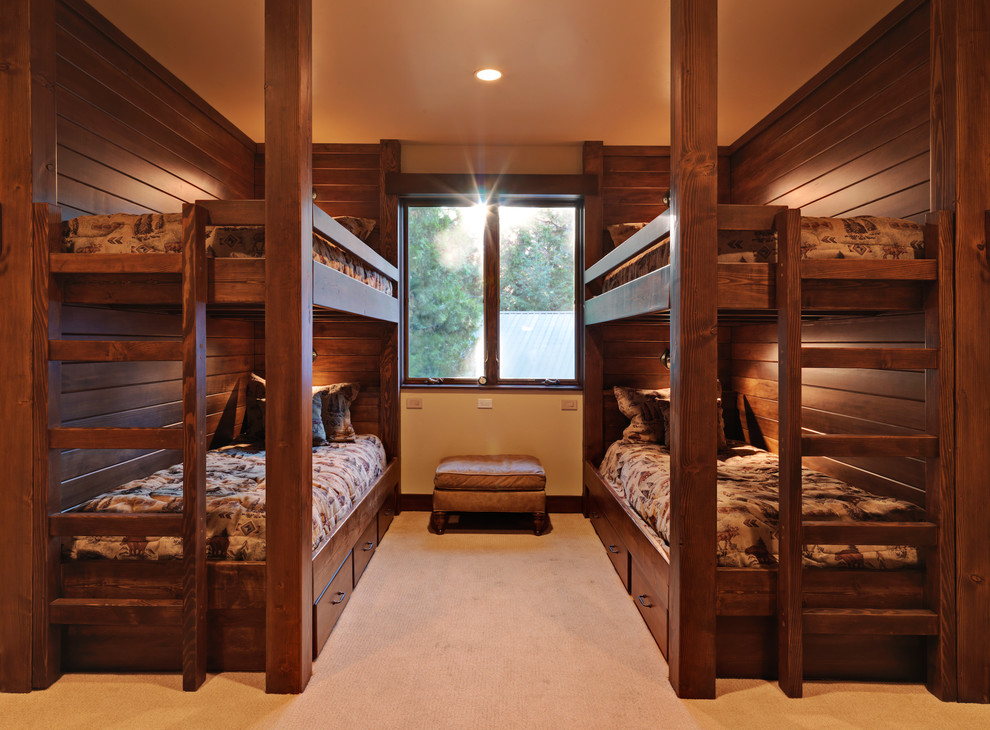 This is an example of a traditional bedroom in Sacramento with beige walls and carpet.