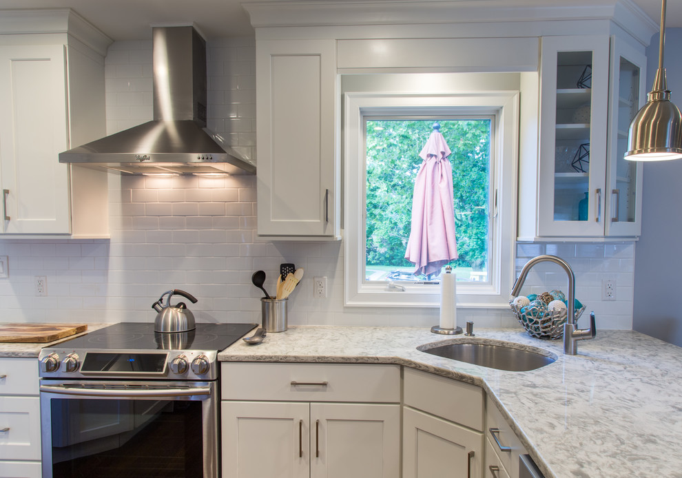 Example of a transitional kitchen design in New York