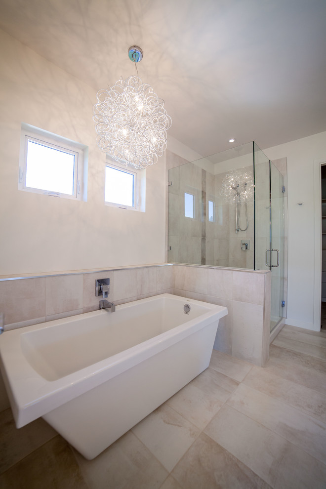 Large contemporary master bathroom in Vancouver with a vessel sink, flat-panel cabinets, white cabinets, engineered quartz benchtops, a freestanding tub, a curbless shower, a one-piece toilet, beige tile, white walls and ceramic floors.