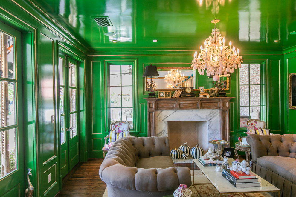 Photo of a mid-sized eclectic enclosed living room in Dallas with green walls, dark hardwood floors, a standard fireplace, a stone fireplace surround and brown floor.