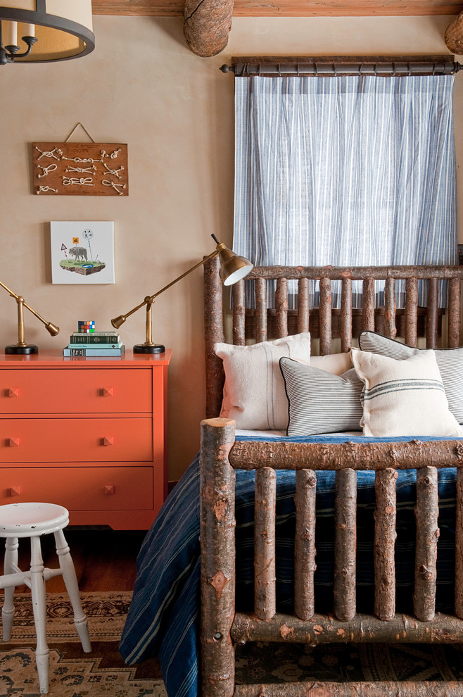 Inspiration for a country bedroom in Other with beige walls.
