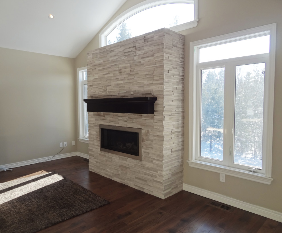 Inspiration for a modern open concept family room in Ottawa with dark hardwood floors, a ribbon fireplace and a stone fireplace surround.