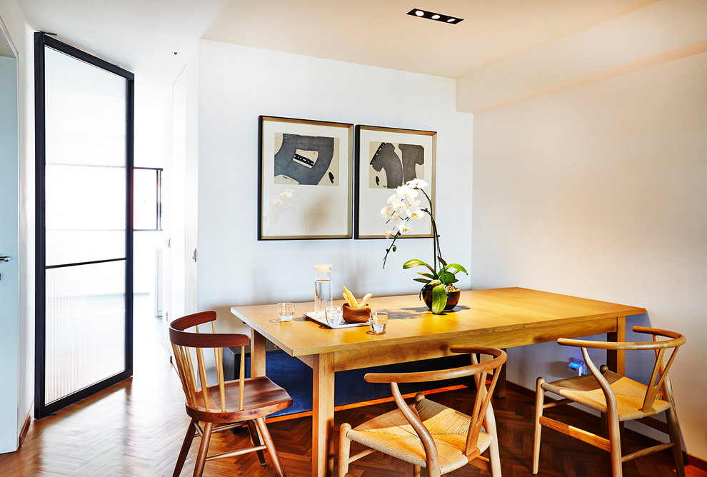 Inspiration for a mid-sized contemporary open plan dining in Singapore with white walls.