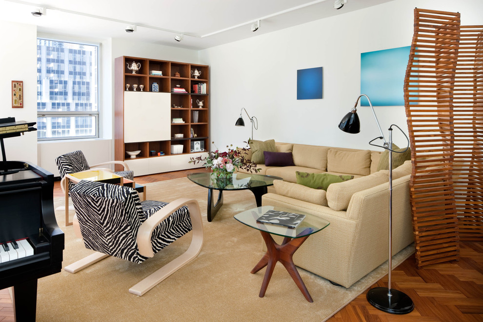 This is an example of a midcentury living room in New York with a music area and white walls.