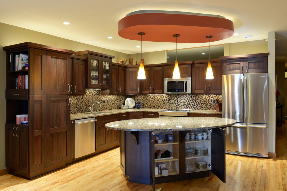 Inspiration for a mid-sized transitional l-shaped light wood floor open concept kitchen remodel with an undermount sink, shaker cabinets, dark wood cabinets, quartzite countertops, multicolored backsplash, mosaic tile backsplash, stainless steel appliances and an island