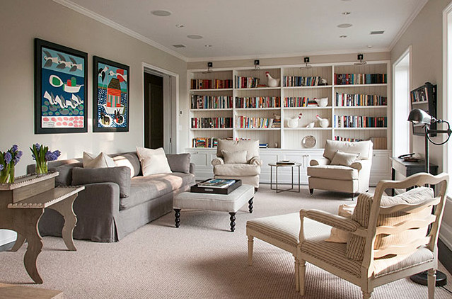 This is an example of a large transitional enclosed living room in New York with a library, grey walls, carpet, no fireplace and a wall-mounted tv.
