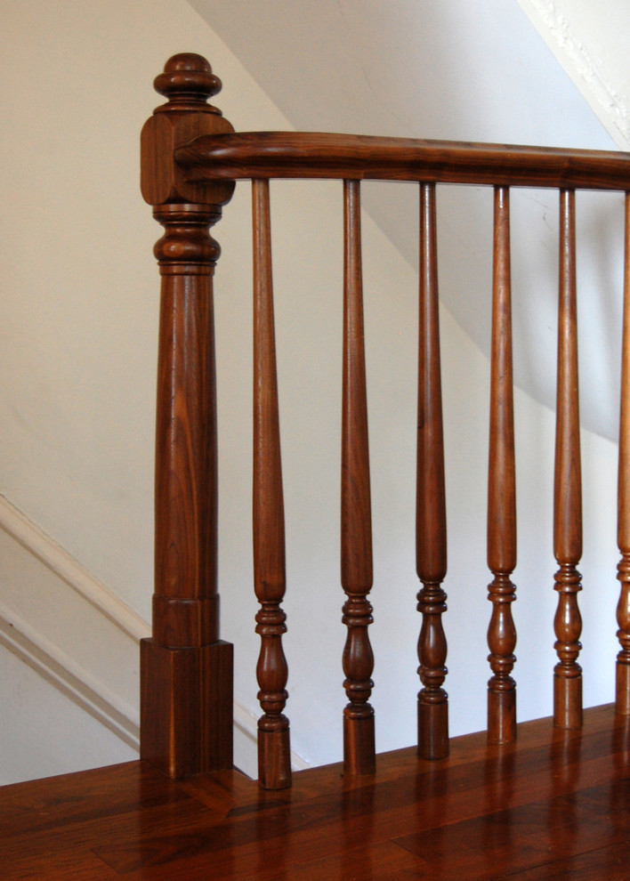 Inspiration for a mid-sized traditional wood straight staircase in Boston with painted wood risers.