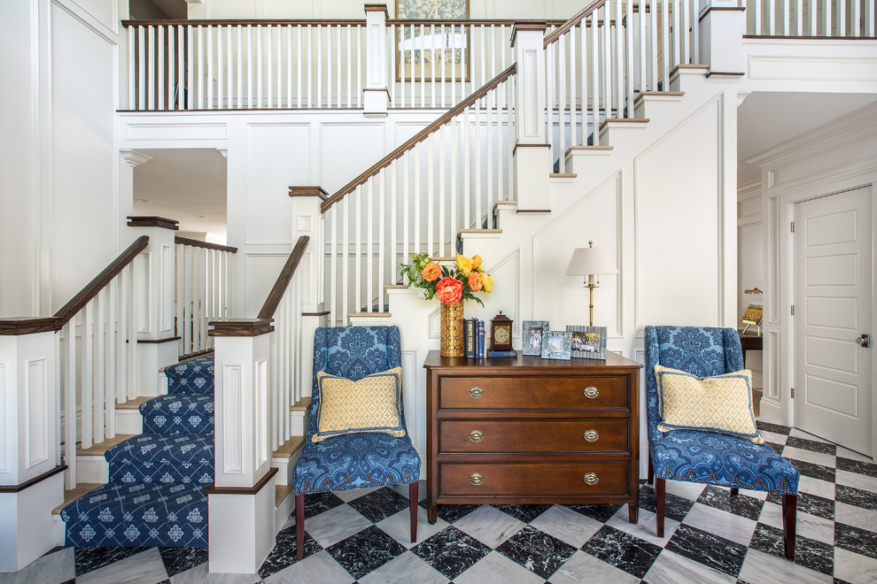 Photo of a traditional wood l-shaped staircase in Salt Lake City with painted wood risers and wood railing.