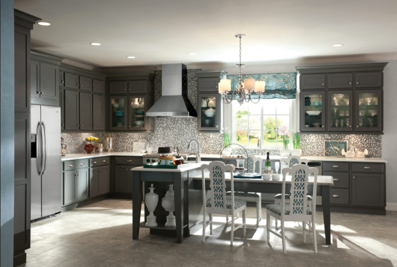 Eat-in kitchen - mid-sized transitional l-shaped ceramic tile and gray floor eat-in kitchen idea with shaker cabinets, gray cabinets, quartzite countertops, gray backsplash, mosaic tile backsplash, stainless steel appliances and an island