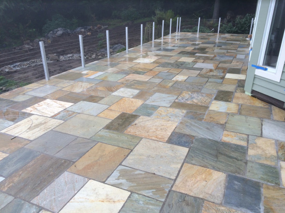 Inspiration for a large modern backyard deck remodel in Seattle with no cover