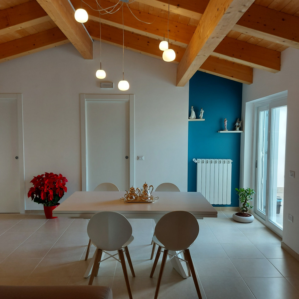 Photo of a mid-sized contemporary loft-style living room in Rome with blue walls, porcelain floors, a wall-mounted tv, white floor and wood.