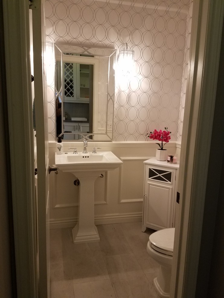 Inspiration for a mid-sized transitional porcelain tile and gray floor bathroom remodel in Orange County with a two-piece toilet, white walls and a pedestal sink