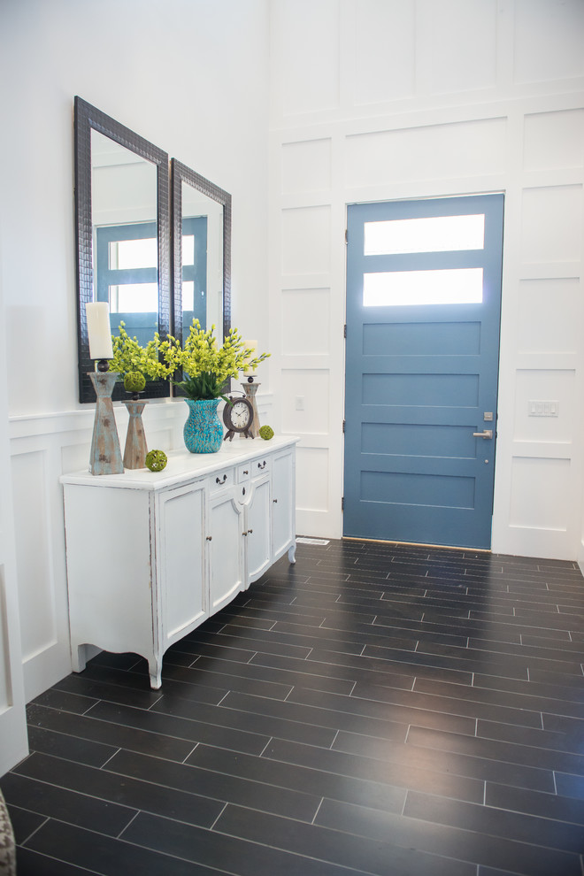 Mid-sized arts and crafts front door in Salt Lake City with white walls, porcelain floors, a single front door and a blue front door.