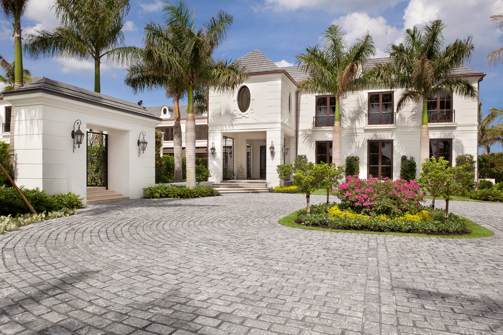 Traditional two-storey white exterior in Miami with a hip roof.