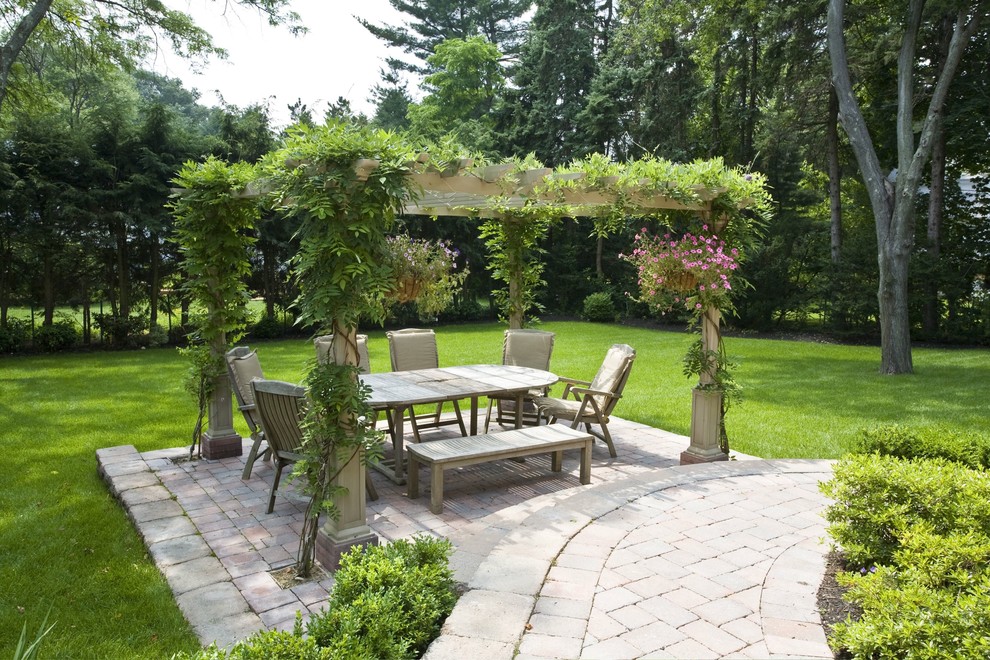 Photo of a traditional patio in Boston with a gazebo/cabana.