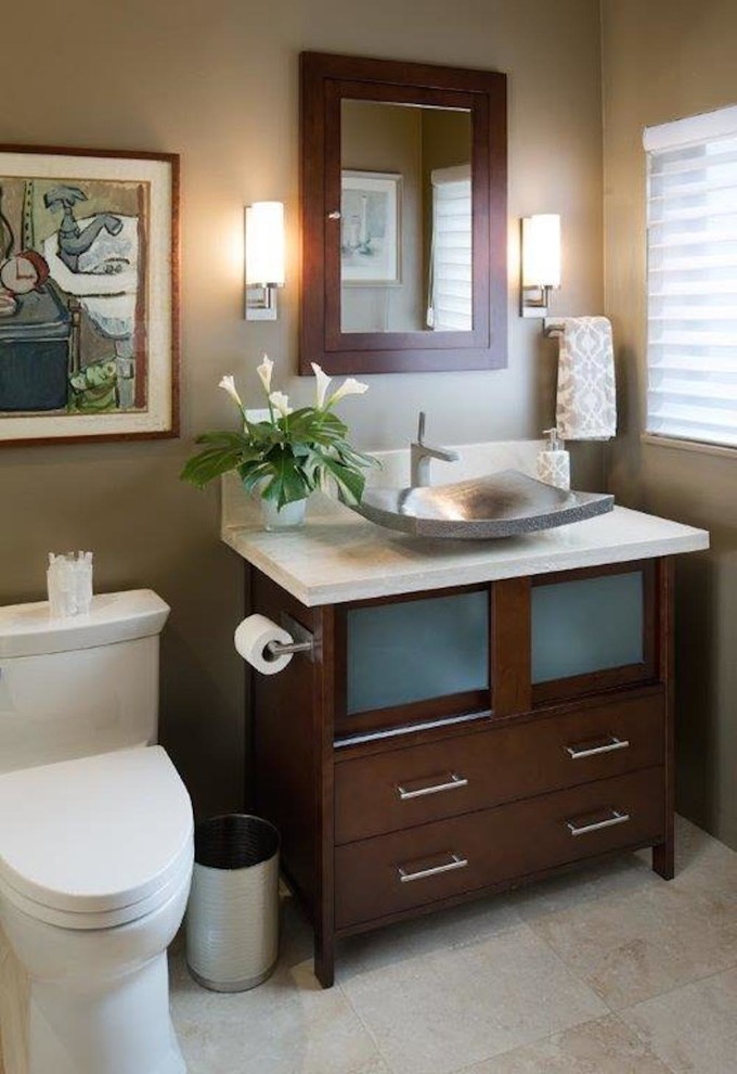 Inspiration for a small contemporary bathroom in San Diego with glass-front cabinets, dark wood cabinets, a double shower, a one-piece toilet, beige tile, stone tile, black walls, travertine floors, a vessel sink and limestone benchtops.