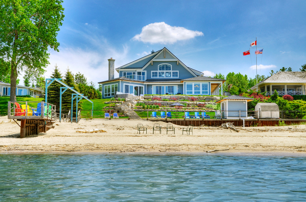 This is an example of a beach style blue exterior in Toronto.