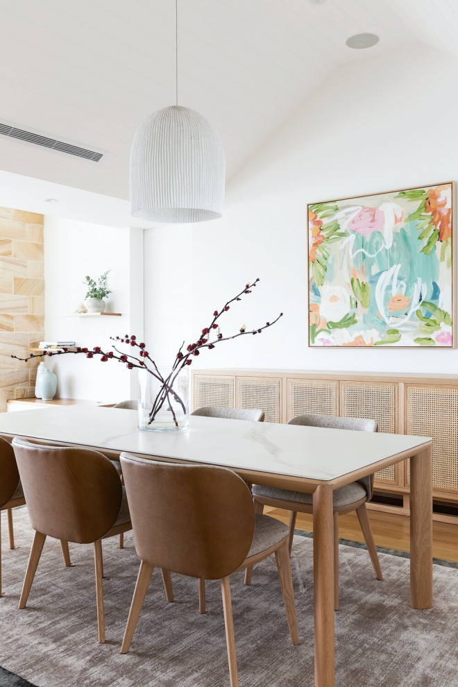Design ideas for a mid-sized beach style dining room in Sydney with white walls and vaulted.