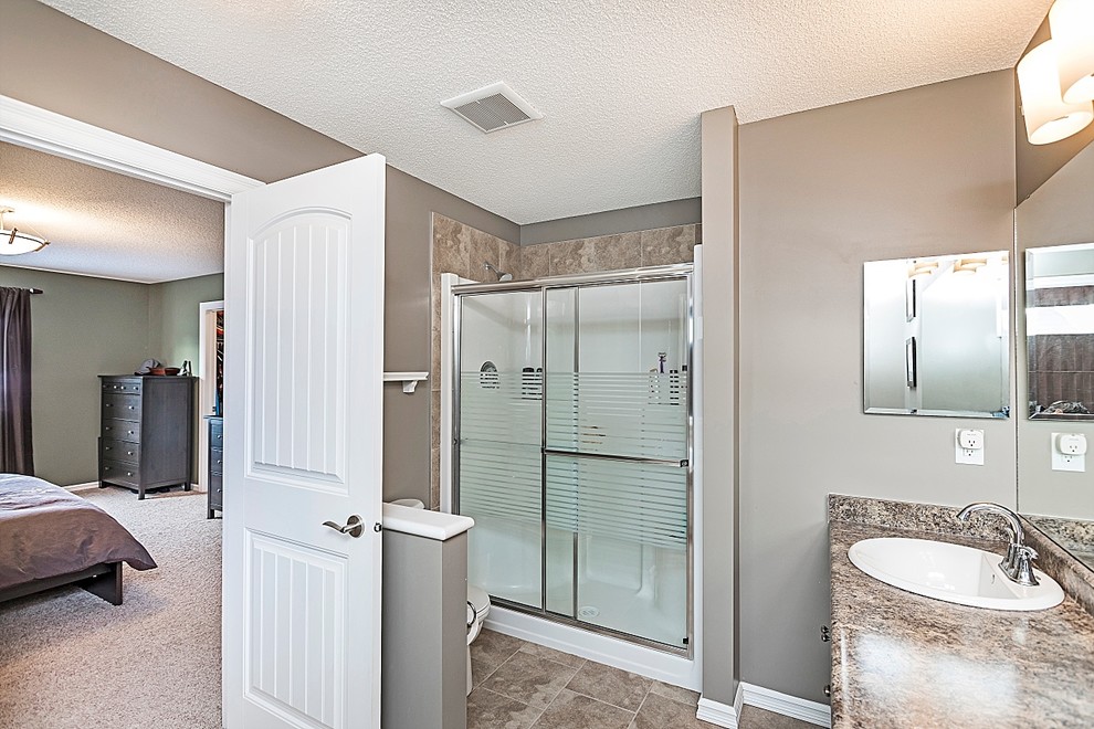 Transitional home design photo in Edmonton