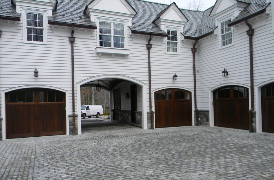 Design ideas for a large arts and crafts attached four-car porte cochere in New York.