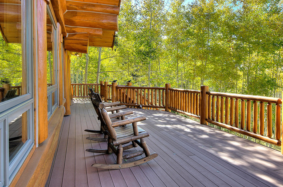 Inspiration for a large country deck in Denver with a roof extension.