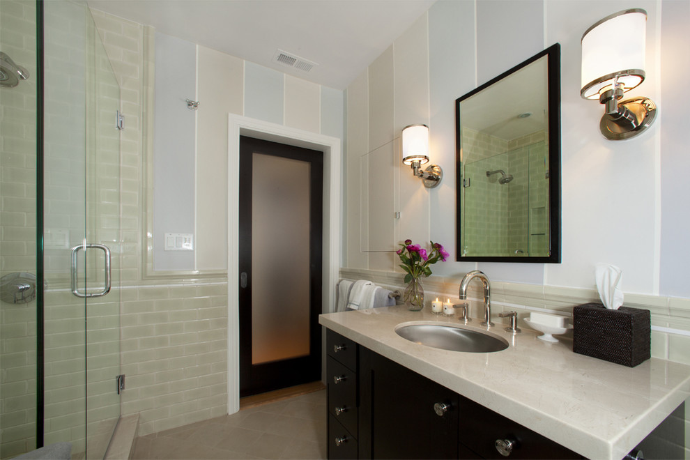 This is an example of a small traditional master bathroom in San Francisco with black cabinets, subway tile, a drop-in sink, flat-panel cabinets, marble benchtops, an undermount tub, a corner shower, a one-piece toilet, green tile, multi-coloured walls and porcelain floors.