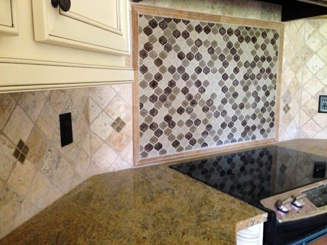 Minimalist eat-in kitchen photo in Atlanta with beige cabinets, granite countertops, multicolored backsplash, recessed-panel cabinets and stone tile backsplash