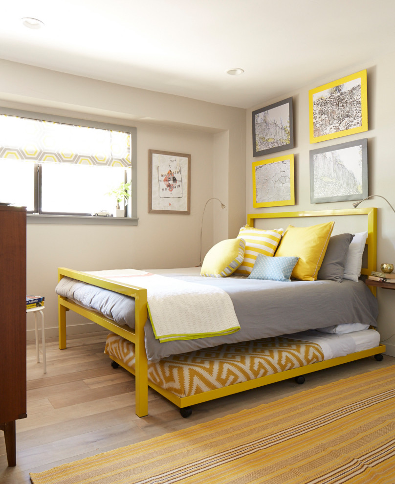 This is an example of a mid-sized midcentury kids' room with grey walls, painted wood floors and grey floor.