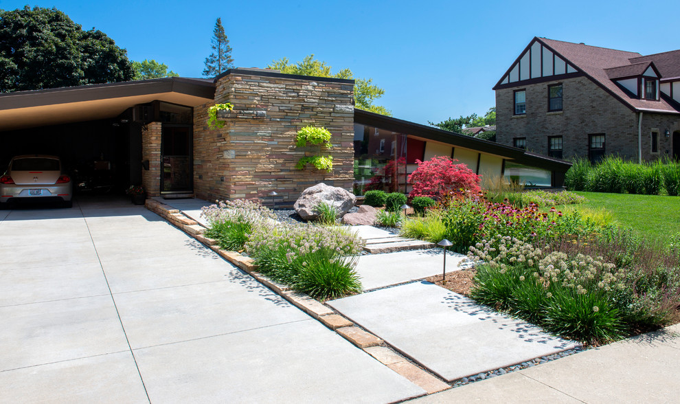 Design ideas for a mid-sized midcentury front yard full sun driveway for summer in Milwaukee with a garden path.