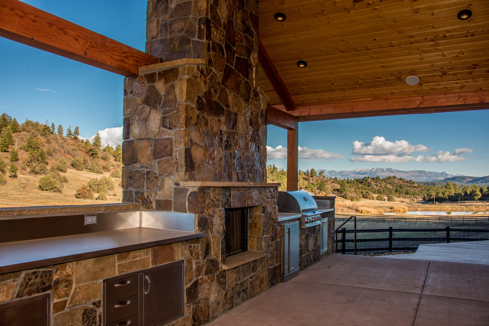 Example of a mountain style home design design in Denver