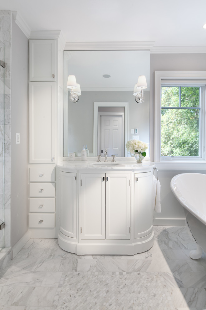 Inspiration for a transitional claw-foot bathtub remodel in DC Metro with an undermount sink, furniture-like cabinets and marble countertops