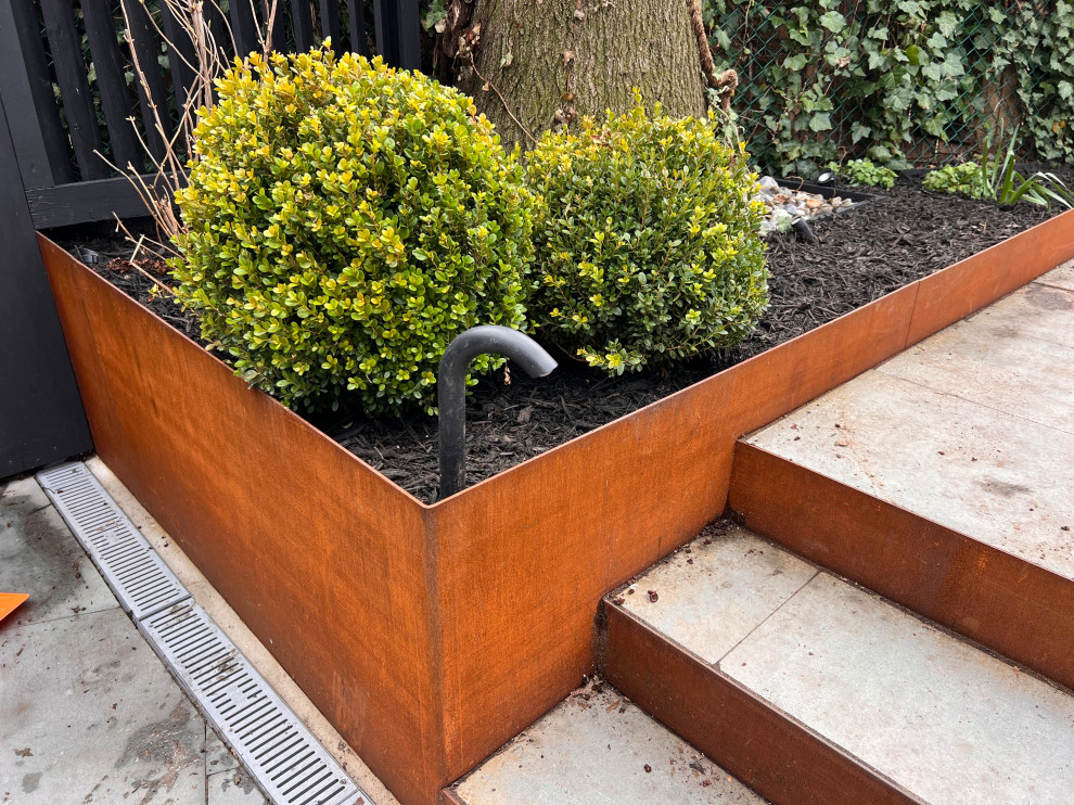 Park Slope backyard corten planters