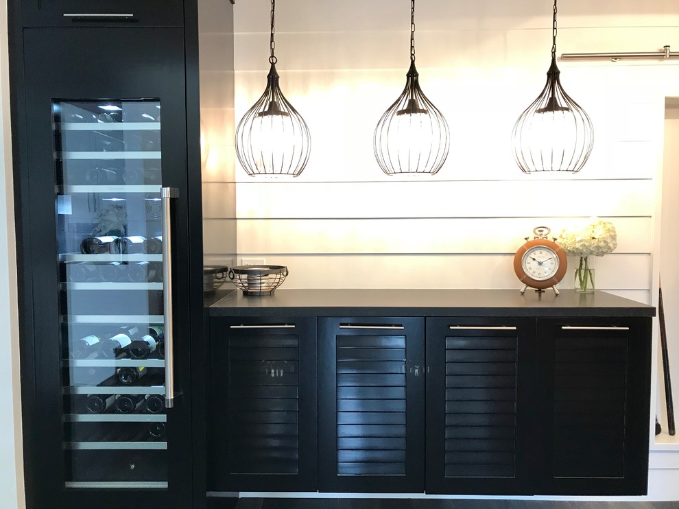 Mid-sized country single-wall home bar in Los Angeles with dark hardwood floors, black floor, no sink, louvered cabinets, black cabinets, quartz benchtops, white splashback, timber splashback and black benchtop.