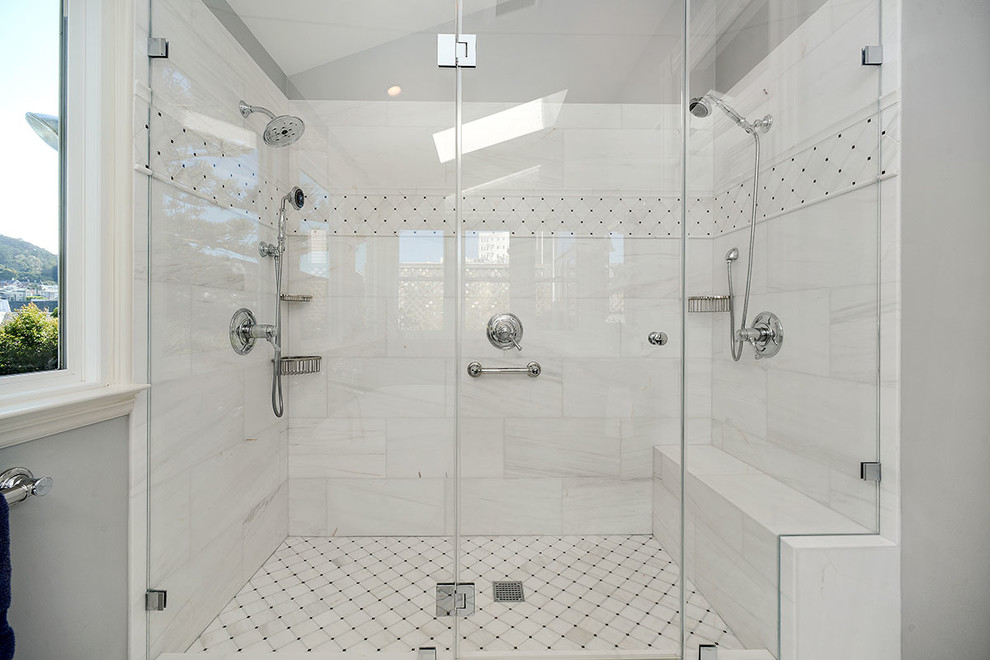 Inspiration for a large traditional master bathroom in San Francisco with recessed-panel cabinets, a freestanding tub, a double shower, a two-piece toilet, marble benchtops, grey cabinets, white tile, marble, grey walls, marble floors, an undermount sink, white floor and a hinged shower door.