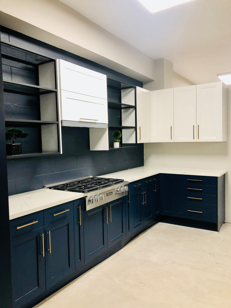 Small contemporary l-shaped kitchen/diner in San Francisco with shaker cabinets, blue cabinets, engineered stone countertops, blue splashback, brick splashback, stainless steel appliances, concrete flooring, no island, grey floors, white worktops and a wood ceiling.