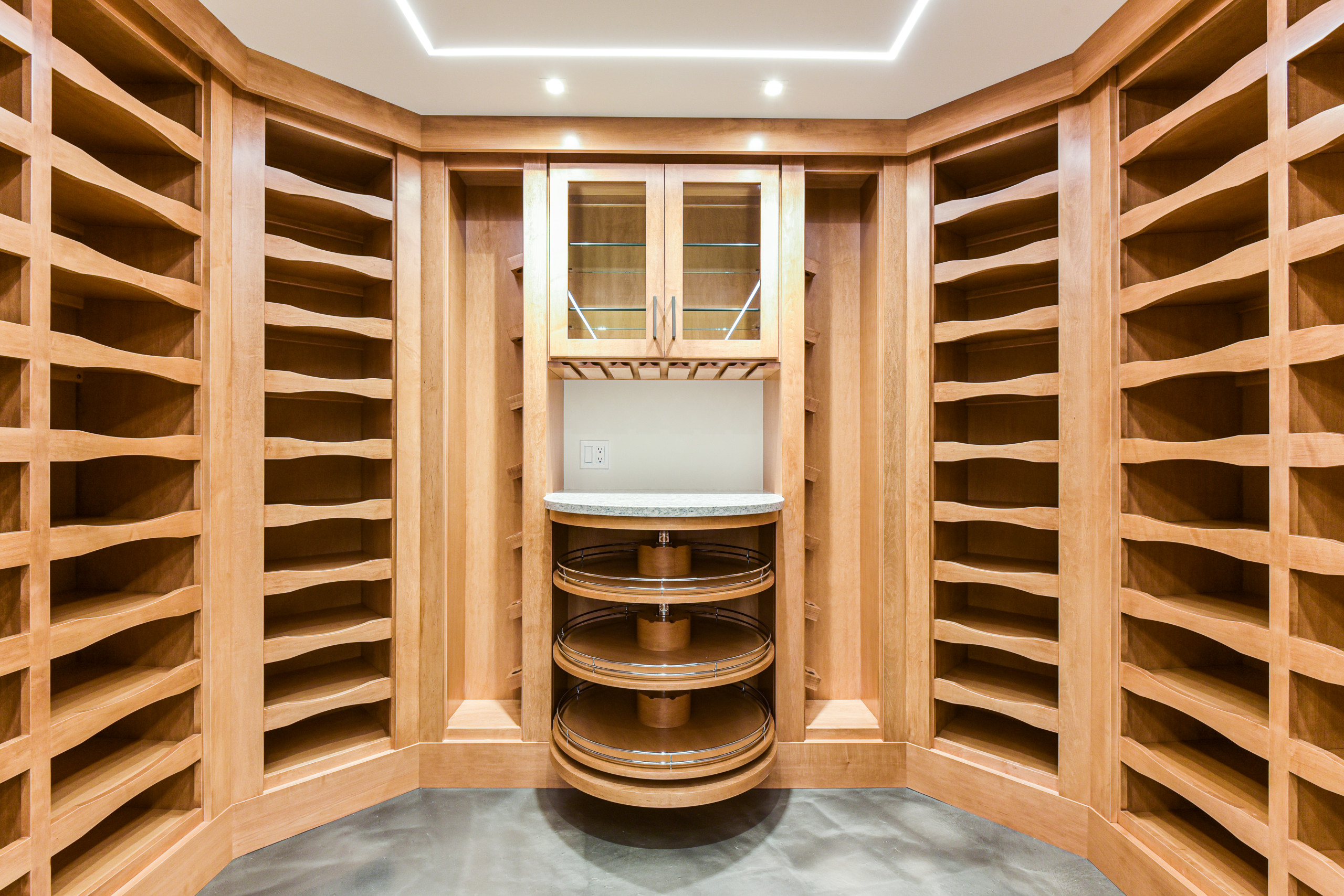 This stunning Arts & Crafts basement wine cellar is the perfect temperature and lighting controlled environment wine lovers. Utilizing limited floor space, we have designed stunning room with features