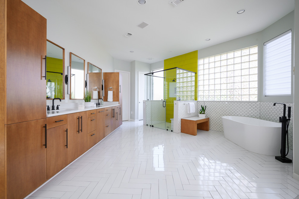 Inspiration for a large contemporary master bathroom in Dallas with light wood cabinets, a freestanding tub, an alcove shower, glass tile, grey walls, ceramic floors, an undermount sink, quartzite benchtops, white floor, white benchtops, flat-panel cabinets, white tile and a hinged shower door.