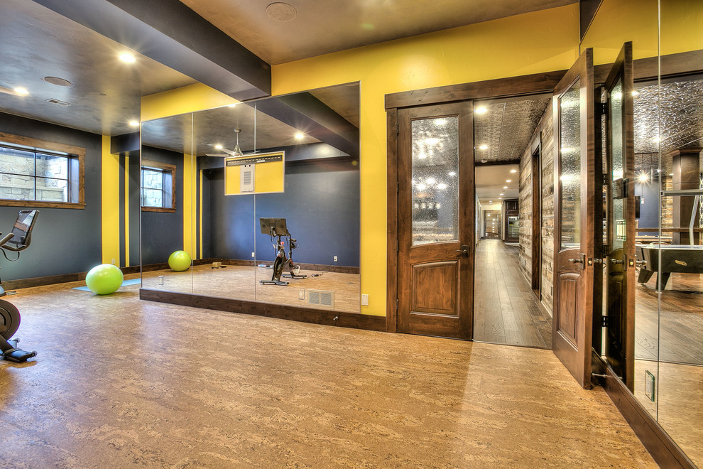 Inspiration for an expansive country multipurpose gym in Denver with yellow walls and linoleum floors.