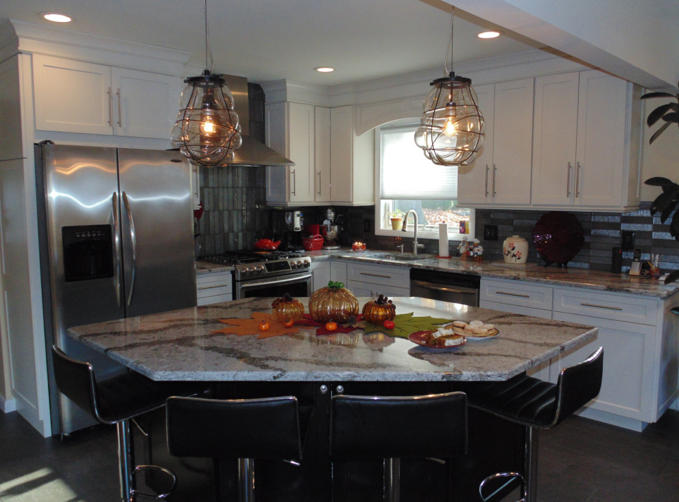 Inspiration for a small transitional l-shaped ceramic tile and brown floor eat-in kitchen remodel with an undermount sink, recessed-panel cabinets, white cabinets, quartz countertops, gray backsplash, subway tile backsplash, stainless steel appliances, an island and gray countertops