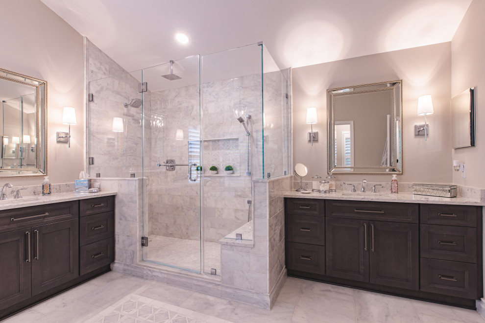 Photo of a large transitional master bathroom in DC Metro with recessed-panel cabinets, grey cabinets, a freestanding tub, a double shower, gray tile, marble, beige walls, marble floors, an undermount sink, engineered quartz benchtops, grey floor, a hinged shower door, white benchtops, a shower seat, a double vanity, a built-in vanity and vaulted.